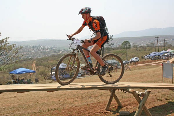 Ryan Swart, a member of the u15 winning team from Liliyfontein School, takes on the see-saw obstacle.