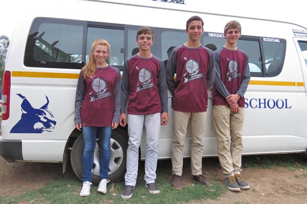 Robyn Emslie, Teo Jordaan, Tess van der Walt & Ryan Swart, members of the winning u15 team from Liliyfontein School relax by the school bus.